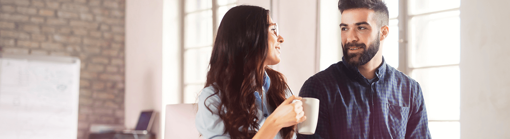 Young couple having a discussion over coffee