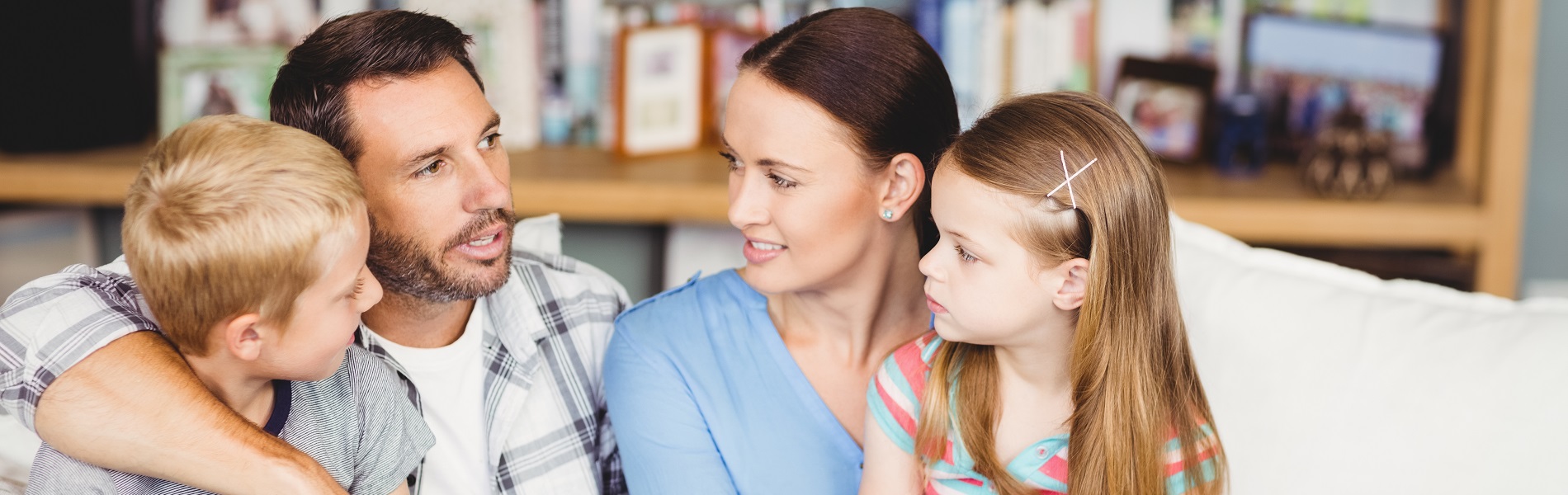 Family looking at each other smiling