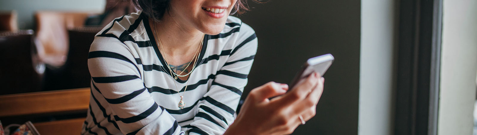 Woman holding phone.